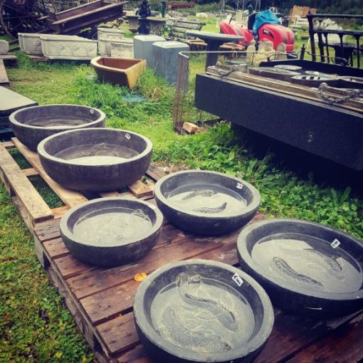 Bowls with fish carving